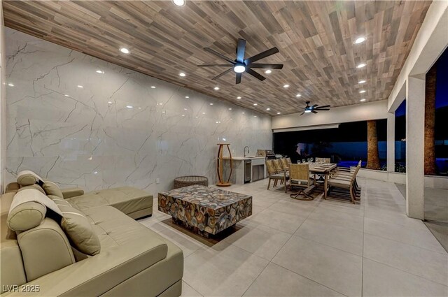 interior space with light tile patterned floors, recessed lighting, and ceiling fan