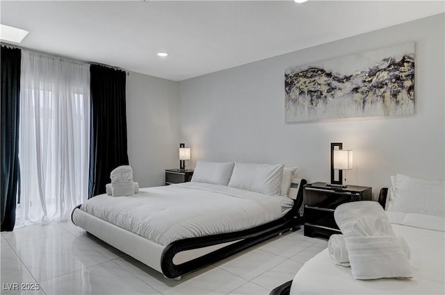 bedroom with recessed lighting and light tile patterned floors