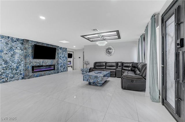 tiled living room with a glass covered fireplace