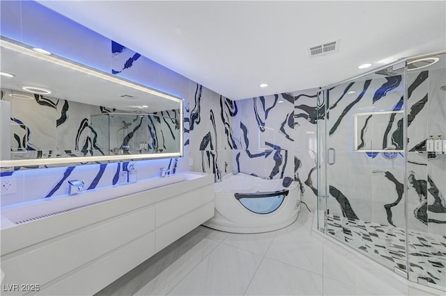 bathroom featuring a marble finish shower, a garden tub, recessed lighting, double vanity, and marble finish flooring