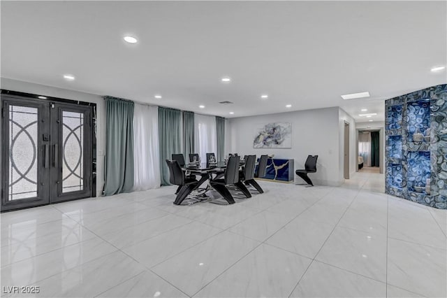 dining room with french doors, recessed lighting, and light tile patterned floors