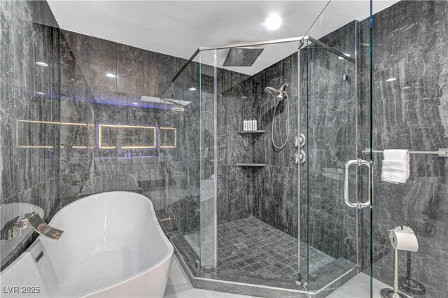 full bath featuring a freestanding bath and a stall shower