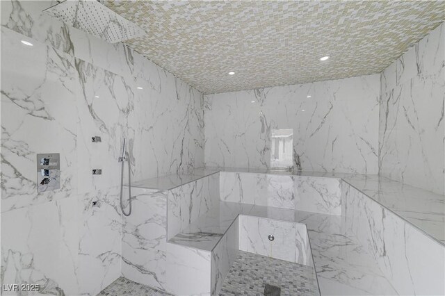 full bath featuring a marble finish shower and recessed lighting