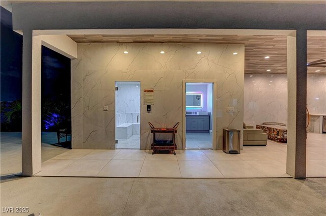 misc room featuring recessed lighting and concrete flooring