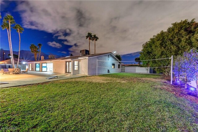 back of property with a patio area and central air condition unit