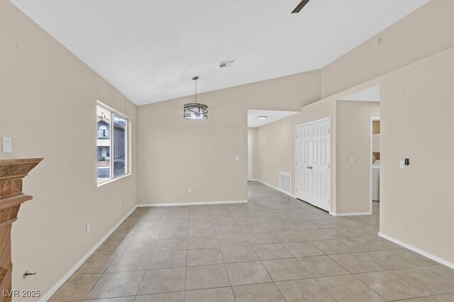 5820 Royal Castle Ln, Las Vegas, NV 89130 - unfurnished dining area with light tile patterned floors, visible vents, baseboards, washer / dryer, and vaulted ceiling