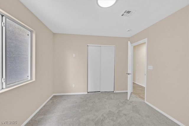 5820 Royal Castle Ln, Las Vegas, NV 89130 - unfurnished bedroom with a closet, visible vents, baseboards, and carpet floors