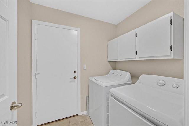 5820 Royal Castle Ln, Las Vegas, NV 89130 - laundry area with washing machine and clothes dryer, light tile patterned flooring, cabinet space, and baseboards