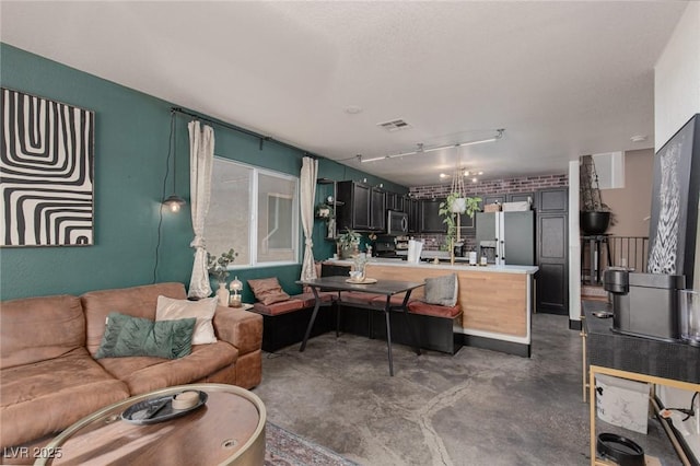 10403 Fancy Fern St, Las Vegas, NV 89183 - living area featuring finished concrete floors