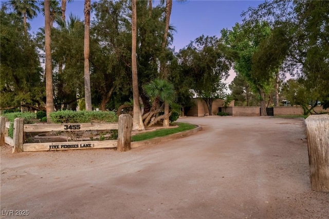 view of front of house featuring curved driveway