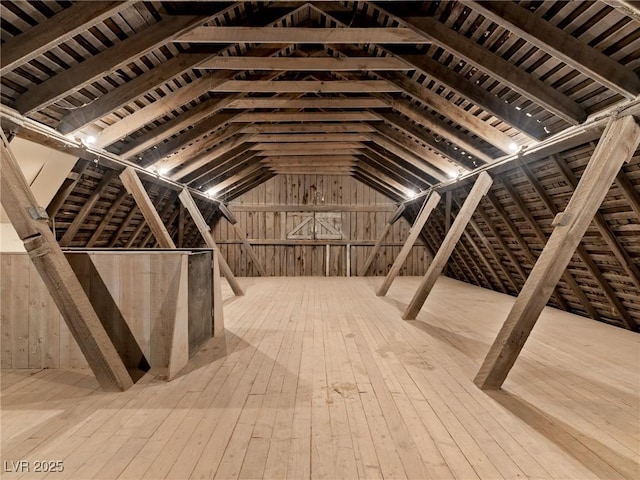 attic featuring an upstairs landing