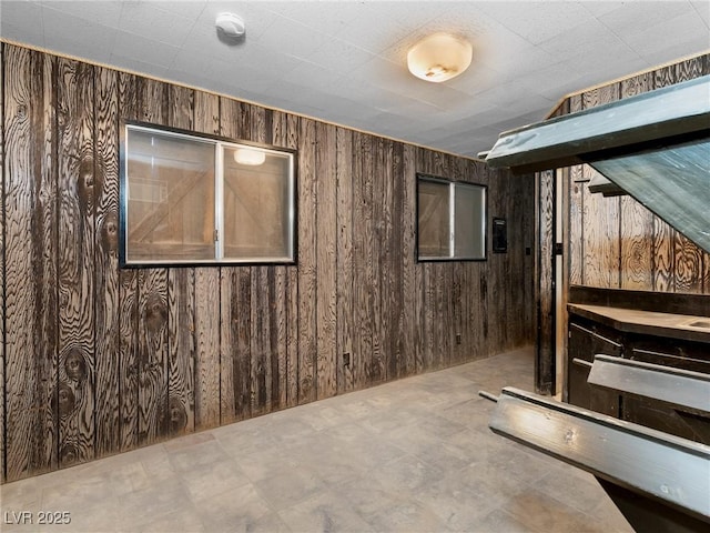 unfurnished bedroom with wood walls
