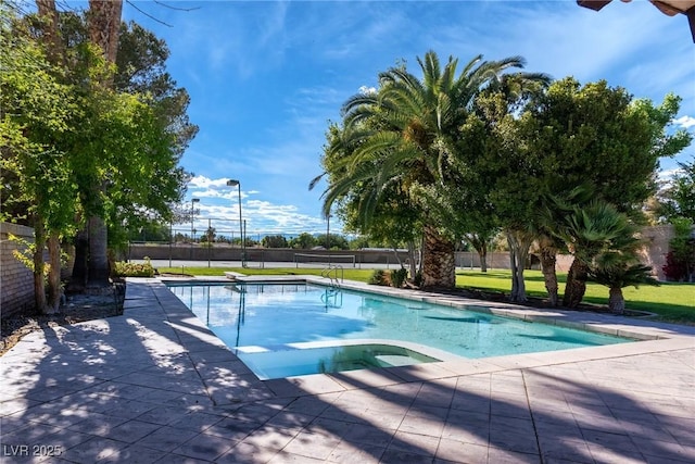 view of pool with a patio area, fence, and a fenced in pool