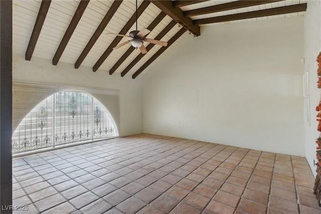tiled empty room featuring wooden ceiling, ceiling fan, and vaulted ceiling with beams