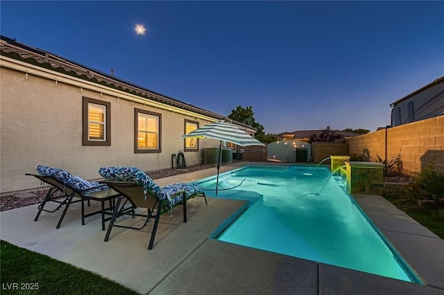 view of swimming pool with a fenced backyard, a patio area, and cooling unit