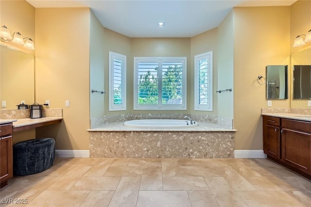 bathroom with a garden tub, baseboards, vanity, tile patterned floors, and recessed lighting