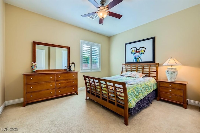 bedroom with baseboards, light colored carpet, and a ceiling fan