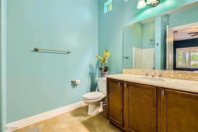 full bath featuring tile patterned floors, vanity, toilet, a shower, and baseboards