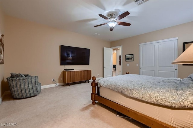 7418 Lawrence Powers Ct, Las Vegas, NV 89129 - bedroom featuring light colored carpet, baseboards, a closet, and a ceiling fan