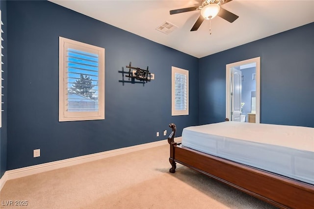 7418 Lawrence Powers Ct, Las Vegas, NV 89129 - carpeted bedroom featuring baseboards, connected bathroom, and a ceiling fan
