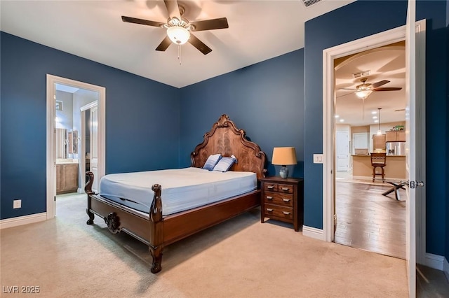 7418 Lawrence Powers Ct, Las Vegas, NV 89129 - bedroom with carpet floors, baseboards, connected bathroom, and a ceiling fan