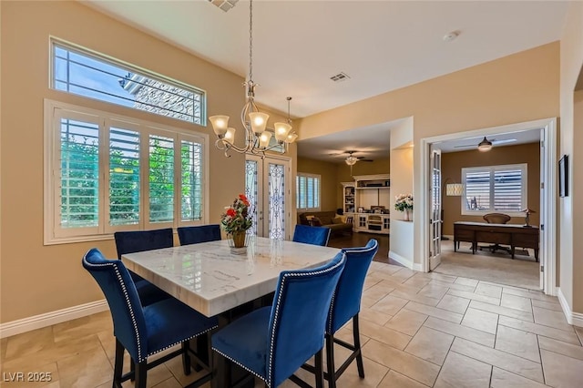 7418 Lawrence Powers Ct, Las Vegas, NV 89129 - dining area with a chandelier, baseboards, and a ceiling fan