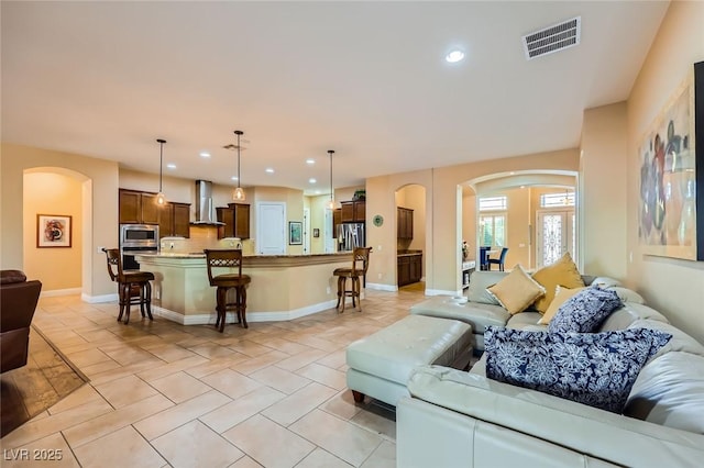7418 Lawrence Powers Ct, Las Vegas, NV 89129 - living area featuring arched walkways, recessed lighting, and baseboards