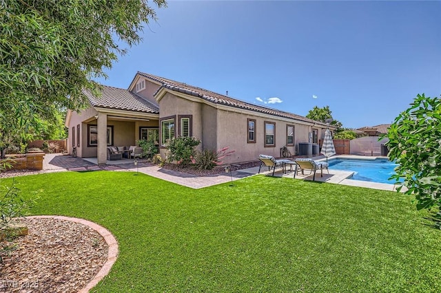 7418 Lawrence Powers Ct, Las Vegas, NV 89129 - back of property featuring a patio, an outdoor living space, stucco siding, and central AC unit