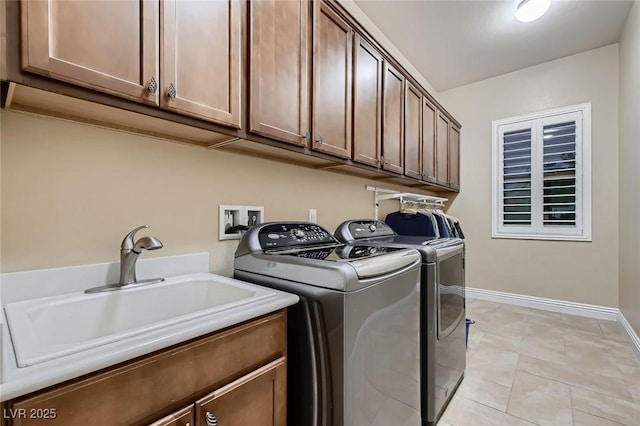 7418 Lawrence Powers Ct, Las Vegas, NV 89129 - laundry room with washer and clothes dryer, cabinet space, and baseboards