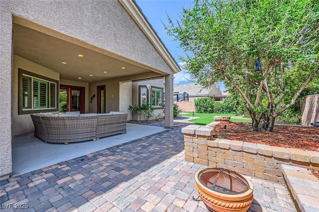 7418 Lawrence Powers Ct, Las Vegas, NV 89129 - view of patio featuring an outdoor living space with a fire pit