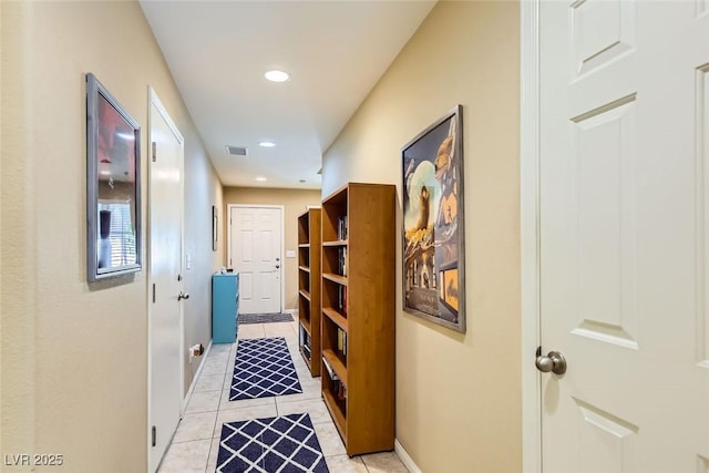 corridor featuring recessed lighting, baseboards, light tile patterned floors, and visible vents