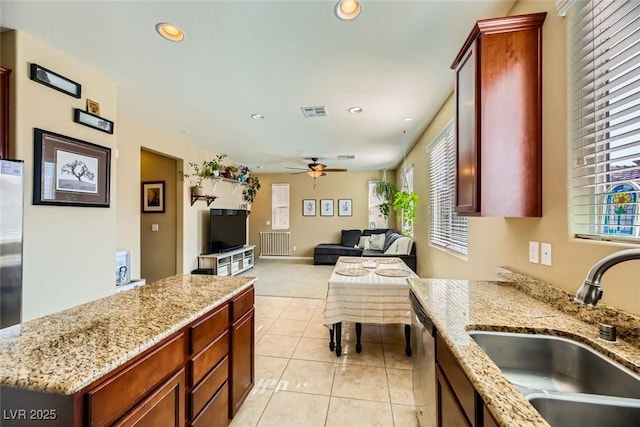 kitchen with a sink, light colored carpet, visible vents, recessed lighting, and a ceiling fan