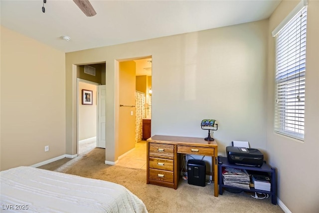bedroom with light colored carpet, baseboards, a ceiling fan, and visible vents