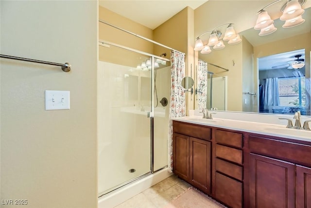 bathroom featuring tile patterned flooring, a stall shower, and a sink