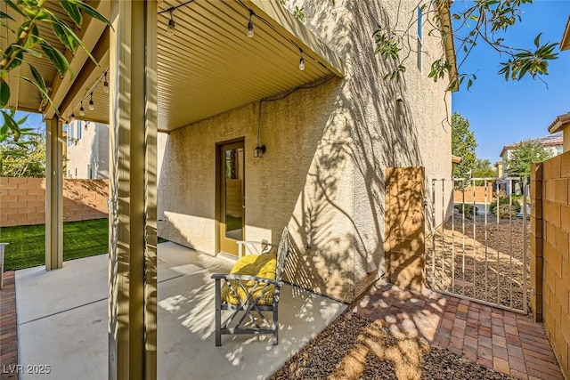 view of patio featuring fence