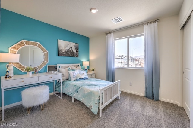 bedroom with carpet flooring, baseboards, and visible vents