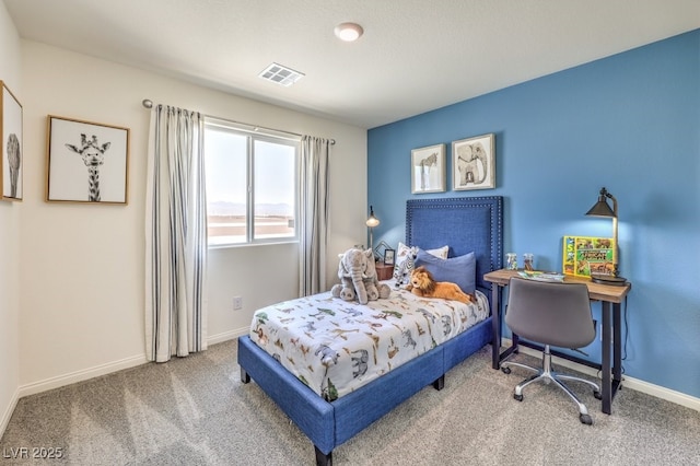 carpeted bedroom featuring baseboards and visible vents