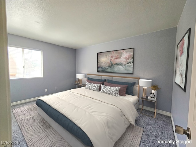 carpeted bedroom featuring a textured ceiling and baseboards