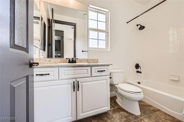 bathroom with toilet, tile patterned flooring, vanity, and shower / washtub combination