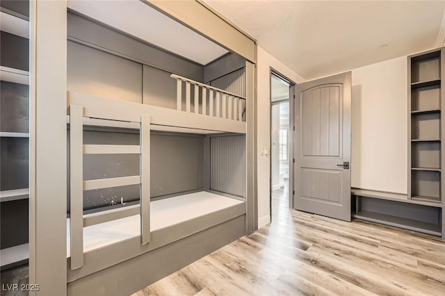 unfurnished bedroom featuring wood finished floors