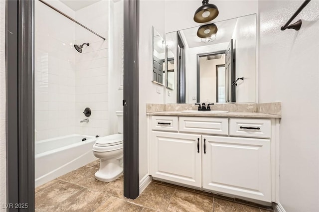 full bath featuring vanity, toilet, and  shower combination