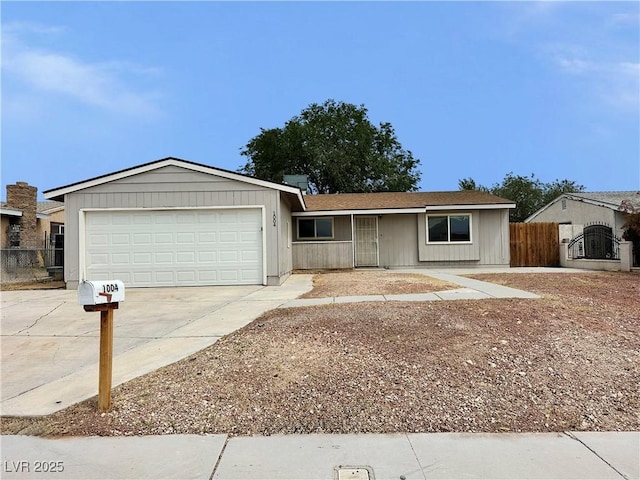 1004 Stone River Dr, North Las Vegas, NV 89030 - ranch-style house featuring concrete driveway, a garage, and fence