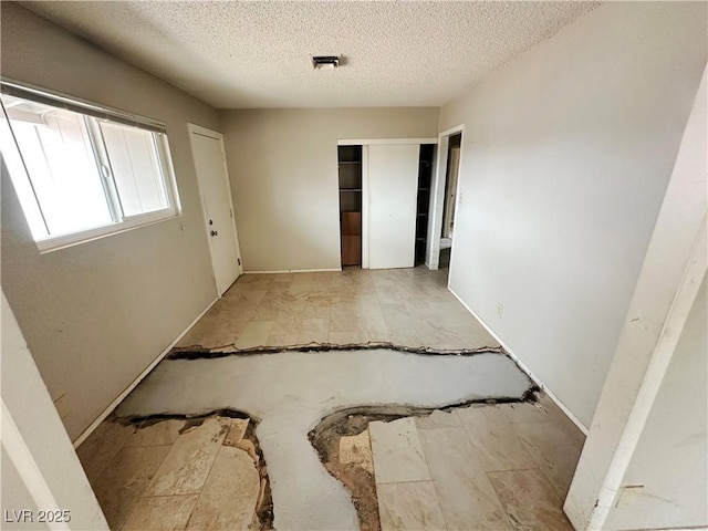 1004 Stone River Dr, North Las Vegas, NV 89030 - unfurnished room featuring a textured ceiling and baseboards