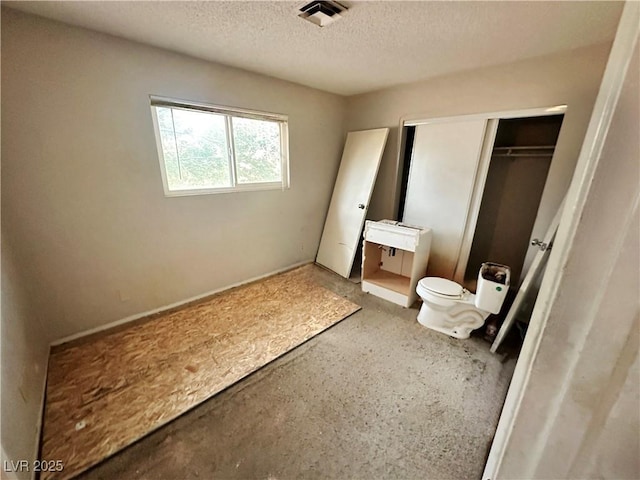 1004 Stone River Dr, North Las Vegas, NV 89030 - bedroom with a textured ceiling and a closet