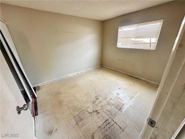 1004 Stone River Dr, North Las Vegas, NV 89030 - spare room featuring a textured ceiling
