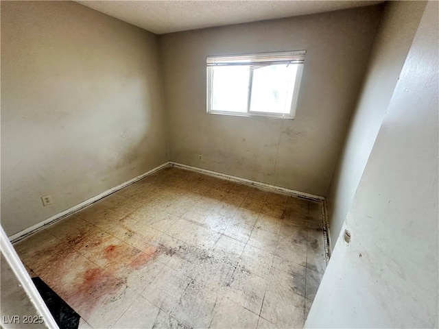 1004 Stone River Dr, North Las Vegas, NV 89030 - empty room with tile patterned floors and baseboards