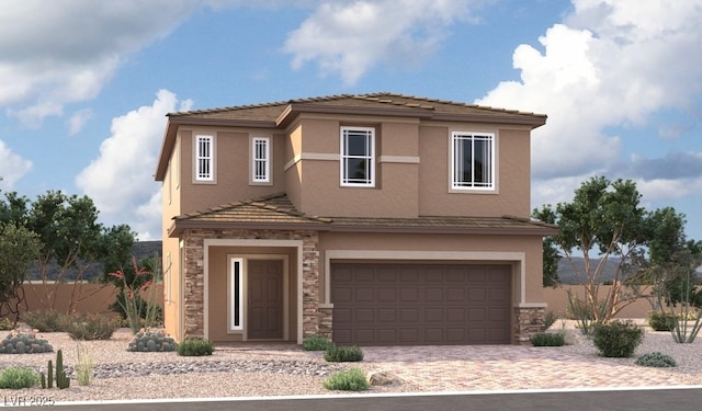 view of front of house with stone siding, fence, stucco siding, and an attached garage