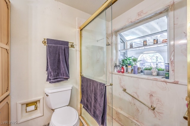 full bathroom with a shower stall and toilet