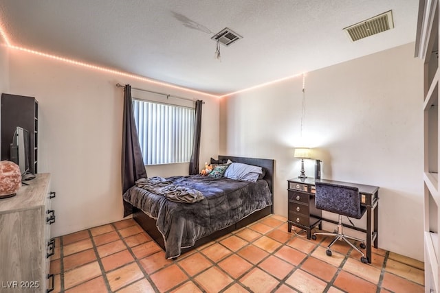 bedroom with light tile patterned flooring and visible vents