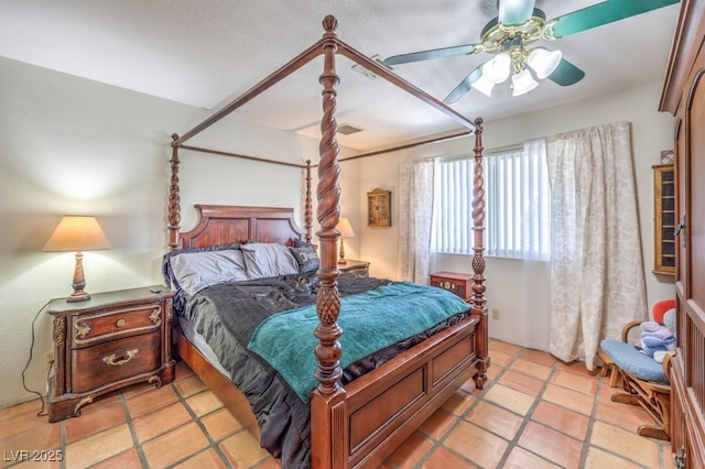 bedroom with light tile patterned floors and a ceiling fan